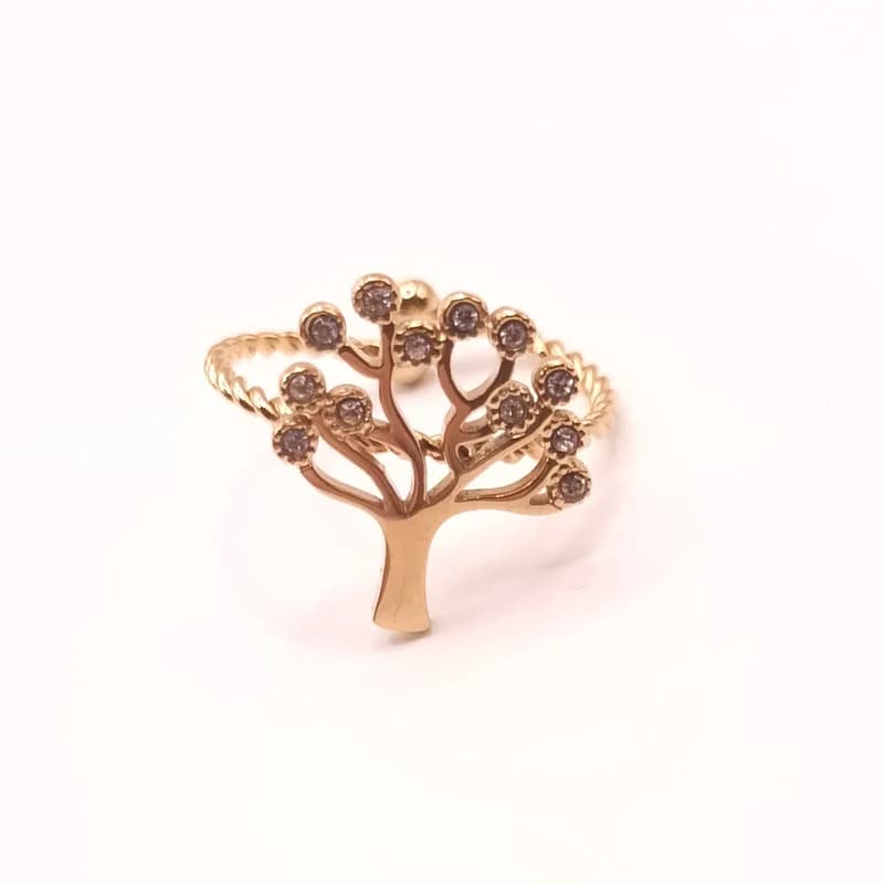 Bague arbre de vie dorée ornée de pierres scintillantes, vue de face.
